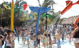 The Sprayground with children playing in water play equipment